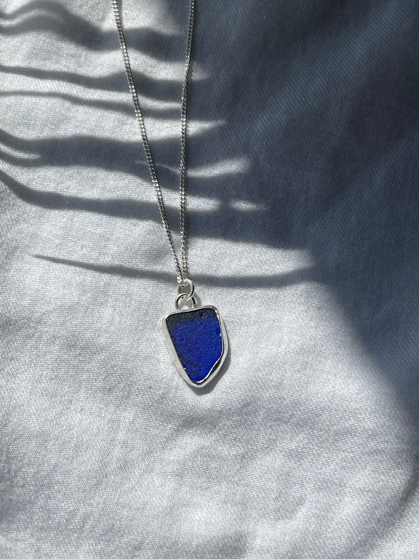 Dark blue sea glass necklace