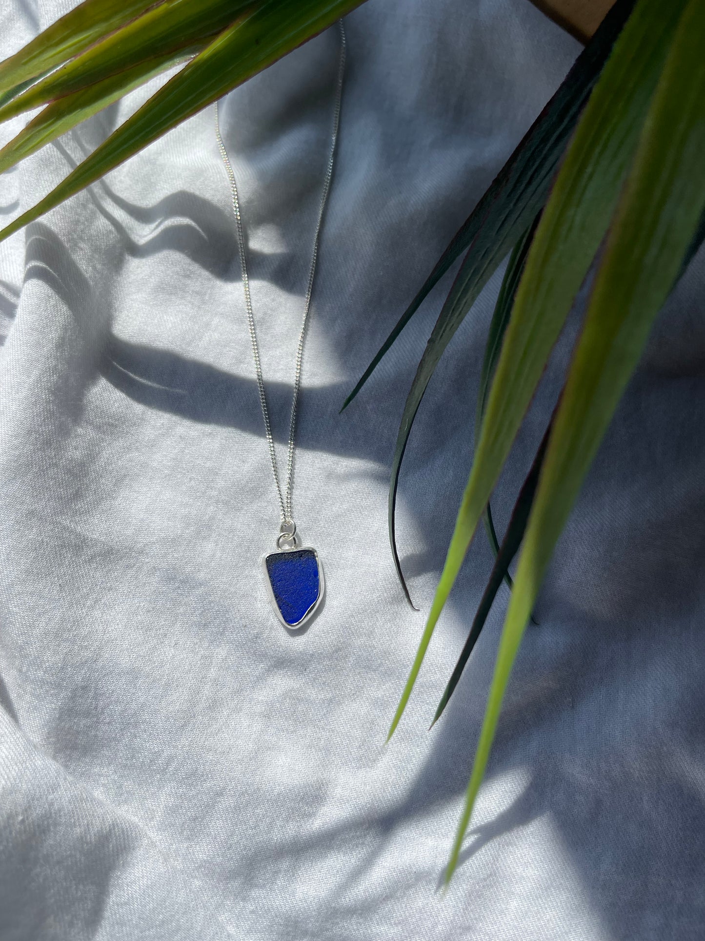 Dark blue sea glass necklace